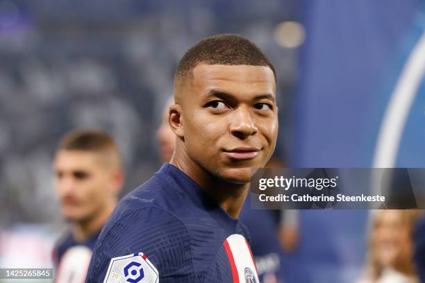 Kylian Mbappe of Paris Saint-Germain looks on before the Ligue 1 match between Olympique Lyonnais and Paris Saint-Germain at Groupama Stadium on...