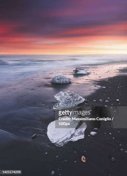 scenic view of sea against sky during sunset,diamond beach,iceland - jokulsarlon stock pictures, royalty-free photos & images