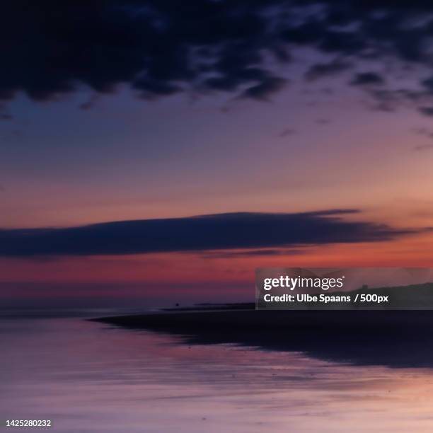 sceni coastc view of sea against dramatic sky during sunset,westland,netherlands - spaans stock pictures, royalty-free photos & images