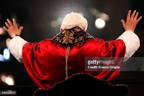Pope Benedict XVI waves to the faithful gathered at the Colosseum during the Way Of The Cross procession on Good Friday April 6, 2012 in Rome, Italy....