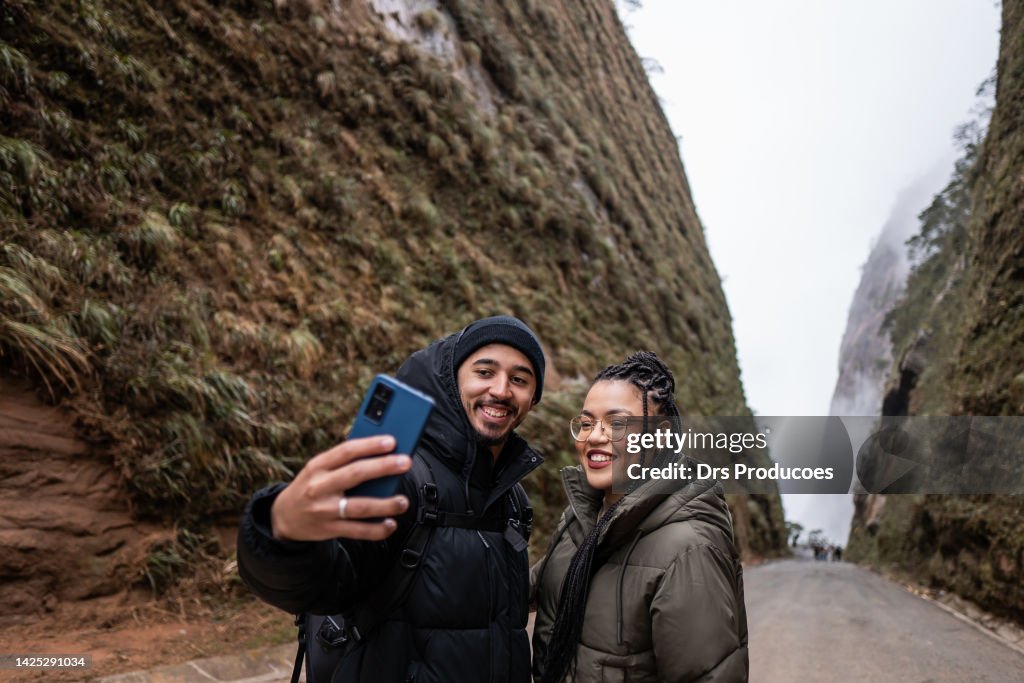 Tourist couple taking selfie in winter in Santa Catarina
