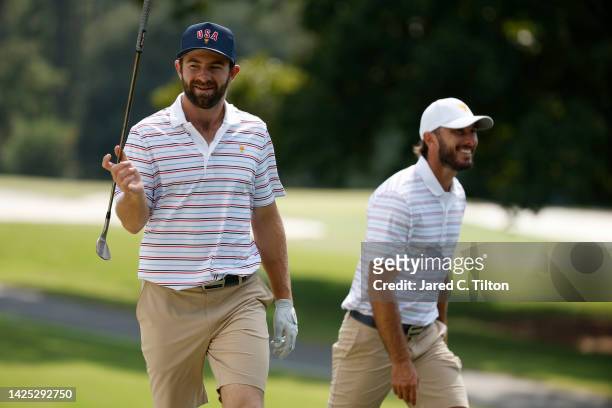 Cameron Young of the United States Team and Max Homa of the United States Team look on prior to the 2022 Presidents Cup at Quail Hollow Country Club...