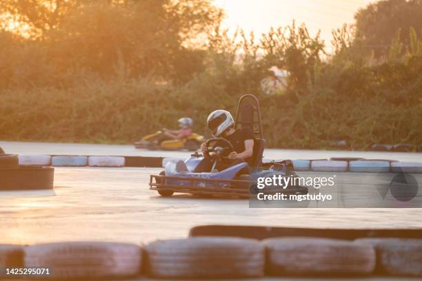 people driving a old go-cart - go carting stock pictures, royalty-free photos & images