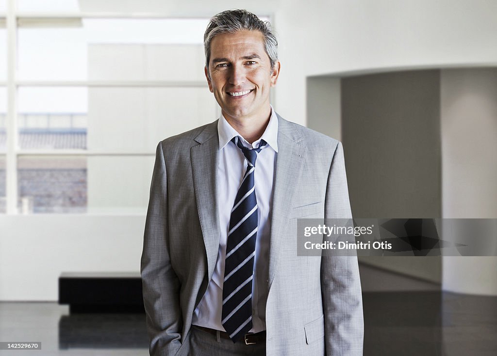 Portrait of relaxed businessman in modern interior