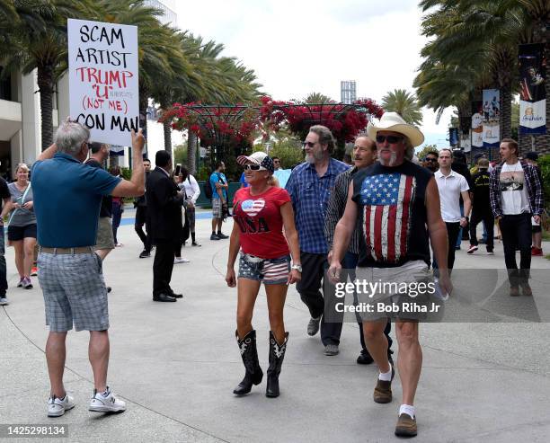 People walk towards the Anaheim Convention Center as U.S. Republican Presidential candidate Donald Trump was to speak inside, May 25, 2016 in...