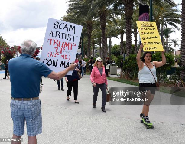 People walk towards the Anaheim Convention Center as U.S. Republican Presidential candidate Donald Trump was to speak inside, May 25, 2016 in...