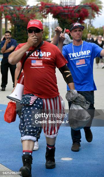 People walk towards the Anaheim Convention Center as U.S. Republican Presidential candidate Donald Trump was to speak inside, May 25, 2016 in...