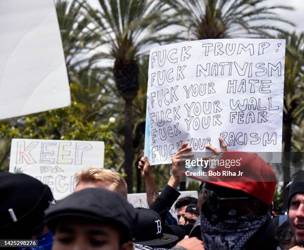 Protestors and supporters face-off with each other as U.S. Republican Presidential candidate Donald Trump was to speak inside Anaheim Convention...