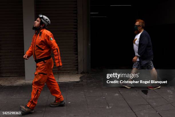 Topo Azteca Rescuer walks outside a building after a 7.7 magnitude quake that struck the west coast in Michoacan State, was felt in Mexico City right...