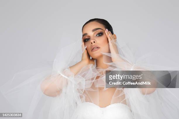 beautiful emotional woman with perfect make-up - white dress stock pictures, royalty-free photos & images