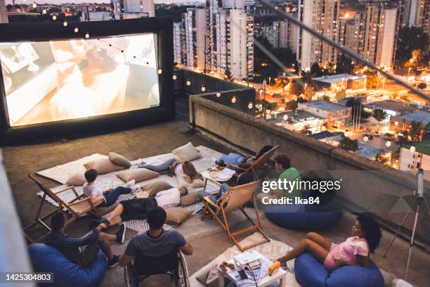 rooftop open-air cinema experience - outdoor cinema stock pictures, royalty-free photos & images