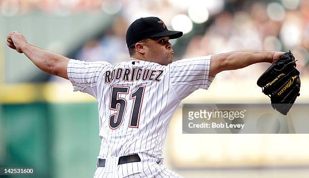 Pitcher Wandy Rodriguez of the Houston Astros throws against the Colorado Rockies during the Opening Day game at Minute Maid Park on April 6, 2012 in...