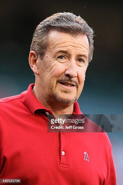 Owner Arte Moreno of the Los Angeles Angels of Anaheim looks on from the field before the Angels take on the Kansas City Royals on Opening Day of the...