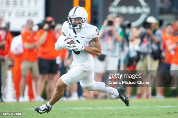 Wide receiver Parker Washington of the Penn State Nittany Lions runs the ball downfield during their game against the Auburn Tigers at Jordan-Hare...