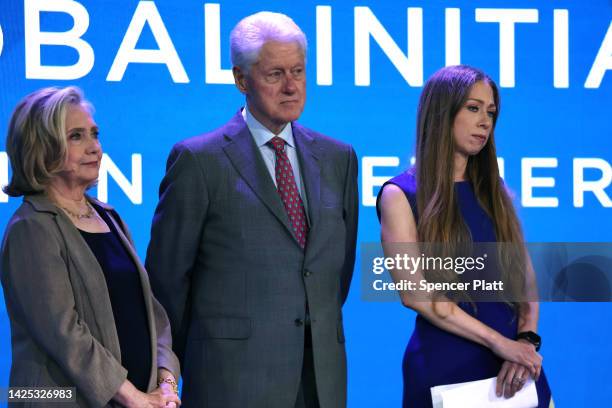 Chelsea Clinton is joined by her parents Hillary Rodham Clinton and former president Bill Clinton on stage during the Clinton Global Initiative , a...