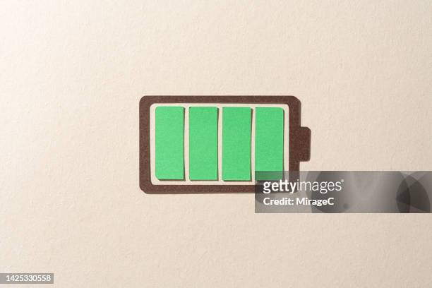a fully charged green battery - full stock pictures, royalty-free photos & images