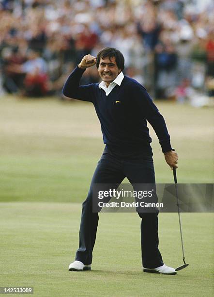 Seve Ballesteros of Spain celebrates after he holes out on the final 18th green to win the 113th Open Championship on 22nd July 1984 on the Old...