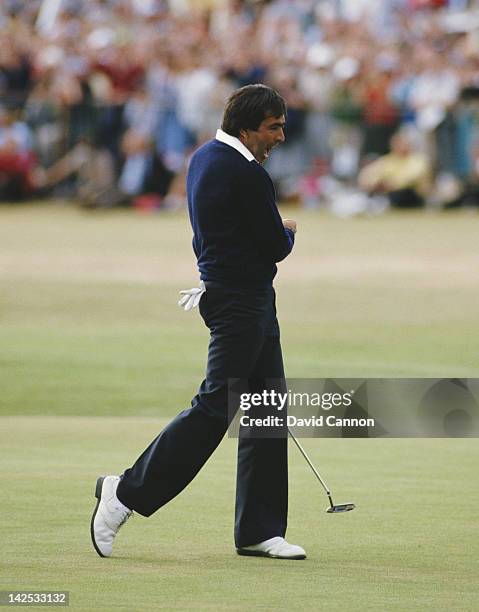 Seve Ballesteros of Spain celebrates after he holes out on the final 18th green to win the 113th Open Championship on 22nd July 1984 on the Old...