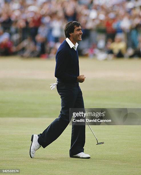 Seve Ballesteros of Spain celebrates after he holes out on the final 18th green to win the 113th Open Championship on 22nd July 1984 on the Old...