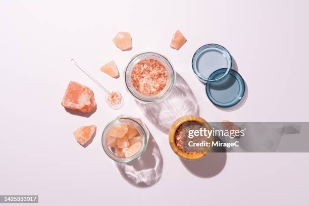 various of pink himalayan salt stored in glass jars - himalayan salt stock-fotos und bilder