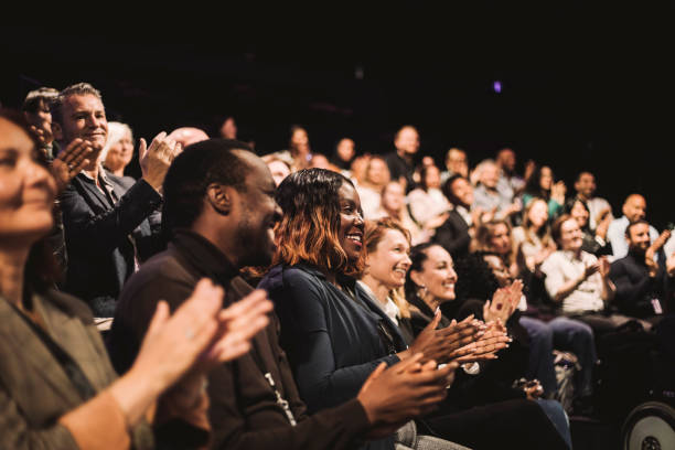 smiling business colleagues applauding during conference event at convention center - clapping hands stock pictures, royalty-free photos & images