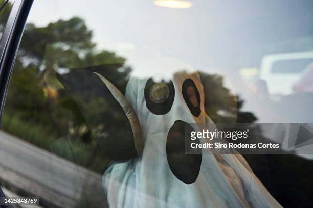 reflection of boy dressed up for halloween in his car - 2022 a funny thing stock pictures, royalty-free photos & images