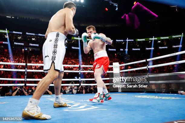 Canelo Alvarez trades punches with Gennadiy Golovkin in the fight for the Super Middleweight Title at T-Mobile Arena on September 17, 2022 in Las...