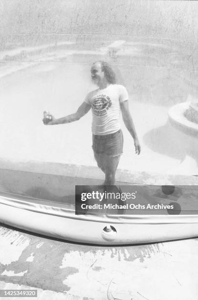 Wearing A Creem Magazine T-Shirt poses for a portrait at home in July 1980 in Los Angeles, California.