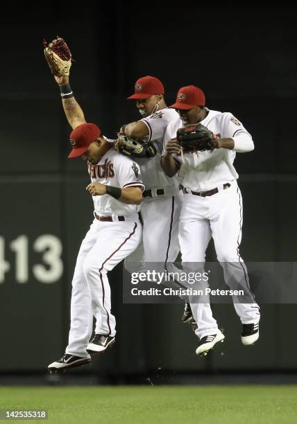 Outfielders Gerardo Parra, Chris Young and Justin Upton of the Arizona Diamondbacks celebrate after defeating the San Francisco Giants in the Opening...