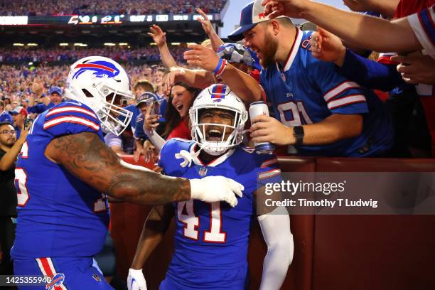 Reggie Gilliam of the Buffalo Bills celebrates with bf76#after scoring a touchdown against the Tennessee Titans during the first quarter of the game...