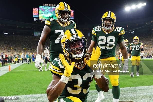 Aaron Jones of the Green Bay Packers celebrates a touchdown against the Chicago Bears during the second quarter at Lambeau Field on September 18,...