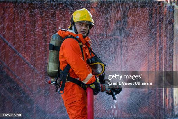 firefighters are extinguishing the fire,fireman. - extinguishing stock pictures, royalty-free photos & images