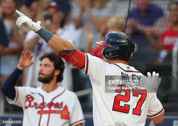 Austin Riley of the Atlanta Braves reacts after hitting a solo homer in the first inning against the Washington Nationals at Truist Park on September...