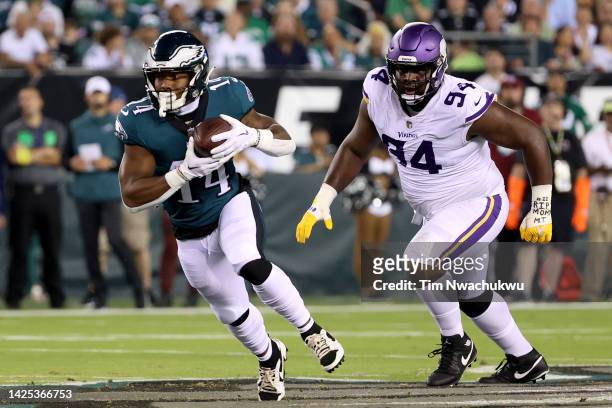 Kenneth Gainwell of the Philadelphia Eagles catches a pass next to Dalvin Tomlinson of the Minnesota Vikings during the first quarter at Lincoln...