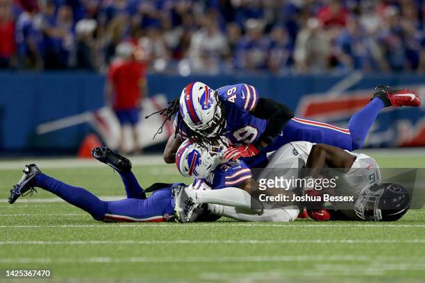 Tremaine Edmunds of the Buffalo Bills collides with teammate Dane Jackson after a play against Treylon Burks of the Tennessee Titans during the...
