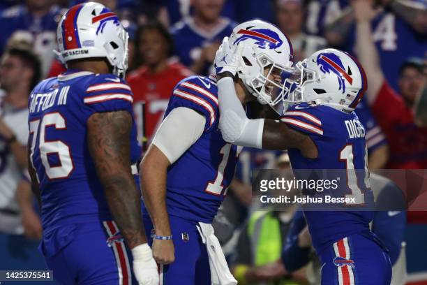 Stefon Diggs of the Buffalo Bills celebrates with teammate Josh Allen after scoring a touchdown against the Tennessee Titans during the third quarter...