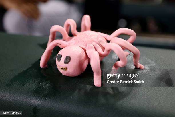 Spider made of bubble gum is seen on the Detroit Tigers dugout as they play against the Baltimore Orioles at Oriole Park at Camden Yards on September...