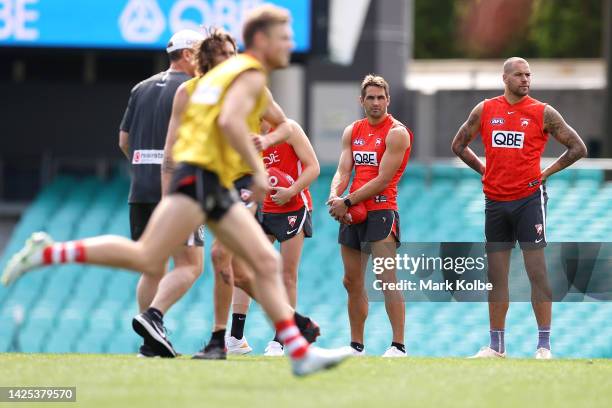 Josh P. Kennedy and Lance Franklin watch on during a Sydney Swans AFL training session at Sydney Cricket Ground on September 20, 2022 in Sydney,...