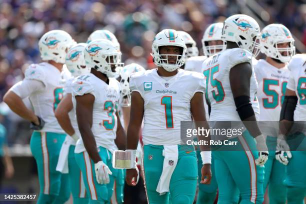 Quarterback Tua Tagovailoa of the Miami Dolphins looks on against the Baltimore Ravens at M&T Bank Stadium on September 18, 2022 in Baltimore,...