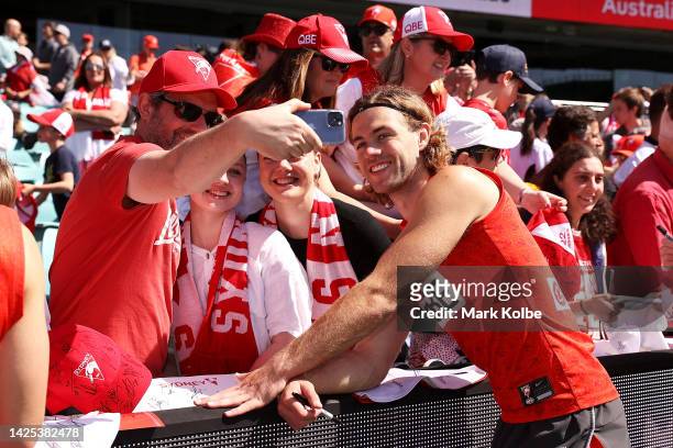 James Rowbottom poses for pictures with Swans supporters after a Sydney Swans AFL training session at Sydney Cricket Ground on September 20, 2022 in...