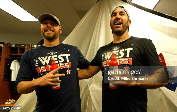Ryan Pressly and Justin Verlander of the Houston Astros celebrate winning the American League West Division following a game against the Tampa Bay...
