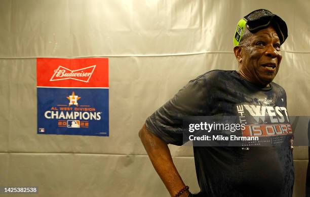 Manager Dusty Baker Jr. #12 of the Houston Astros celebrates winning the American League West Division following a game against the Tampa Bay Rays at...