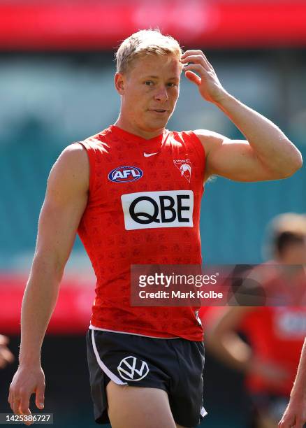 Isaac Heeney looks on during a Sydney Swans AFL training session at Sydney Cricket Ground on September 20, 2022 in Sydney, Australia.