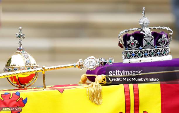 The Sovereign's Orb, Sceptre and The Imperial State Crown sit on top of Queen Elizabeth II's Royal Standard draped coffin at her Committal Service at...