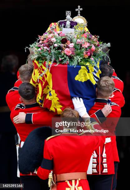 Pallbearers from Queen's Company, 1st Battalion Grenadier Guards carry Queen Elizabeth II's coffin, draped in the Royal Standard, into St George's...