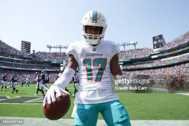 Wide receiver Jaylen Waddle of the Miami Dolphins celebrates after catching a first half touchdown pass against the Baltimore Ravens at M&T Bank...