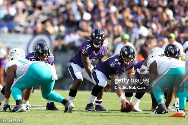 Center Tyler Linderbaum and quarterback Lamar Jackson of the Baltimore Ravens line up against the Miami Dolphins at M&T Bank Stadium on September 18,...