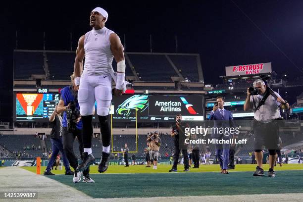 Jalen Hurts of the Philadelphia Eagles celebrates after beating the Minnesota Vikings 24-7 at Lincoln Financial Field on September 19, 2022 in...