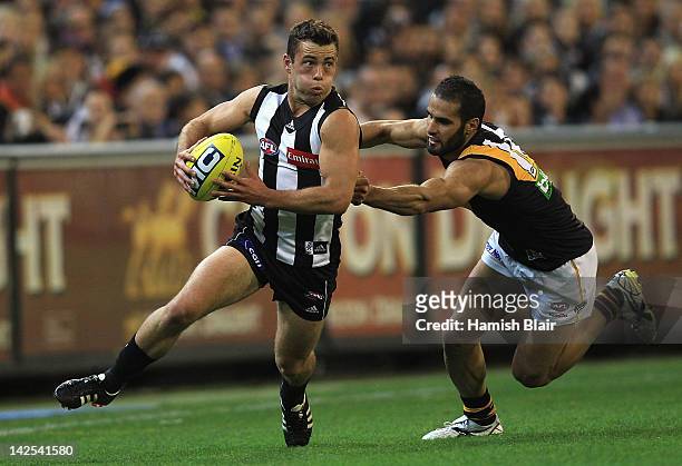 Jarryd Blair of the Magpies runs off Bachar Houli of the Tigers during the round two AFL match between the Collingwood Magpies and the Richmond...