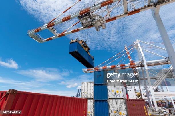 port cargo operation - crane hook stock-fotos und bilder